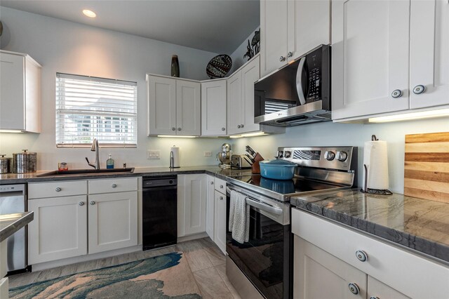 kitchen featuring white cabinets, sink, and appliances with stainless steel finishes