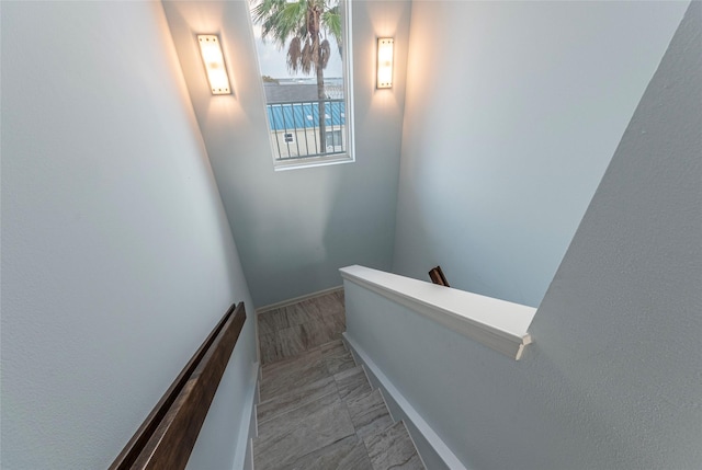 stairs featuring baseboards