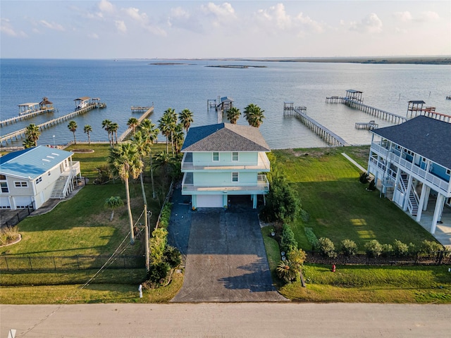 birds eye view of property with a water view