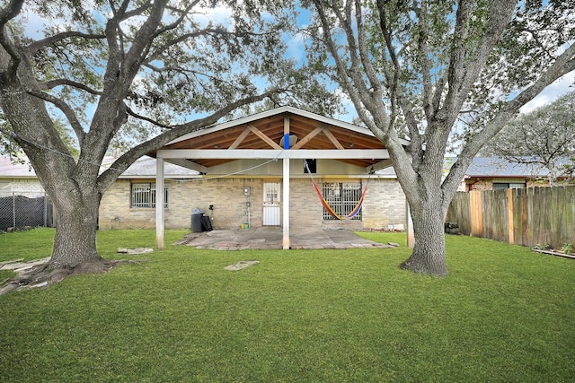 view of front facade featuring a front lawn and a patio area