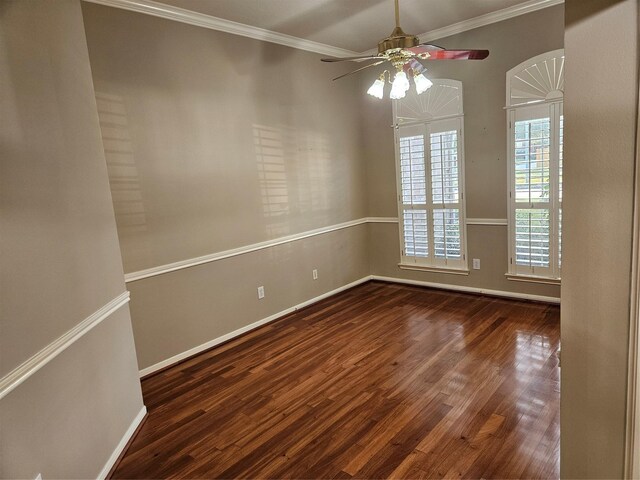 empty room with crown molding, ceiling fan, and dark hardwood / wood-style floors