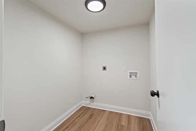 washroom featuring hookup for a washing machine, hardwood / wood-style flooring, and electric dryer hookup