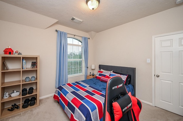 carpeted bedroom with a textured ceiling