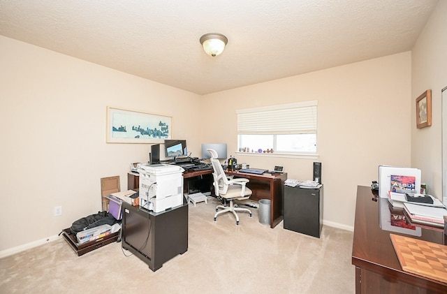 office space featuring light colored carpet and a textured ceiling