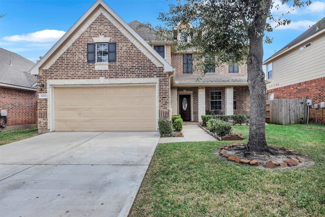 view of property featuring a garage and a front yard