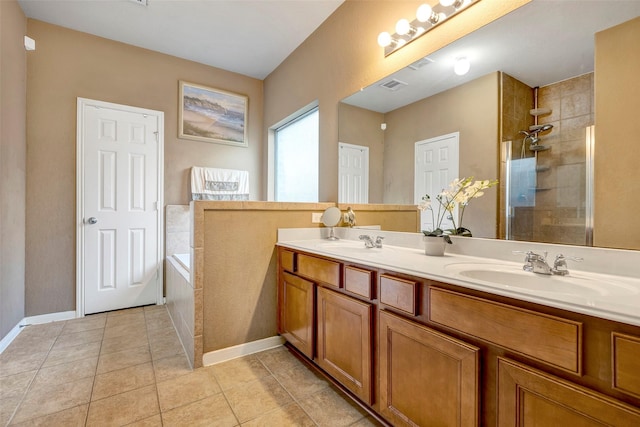 bathroom featuring tile patterned floors, vanity, and independent shower and bath