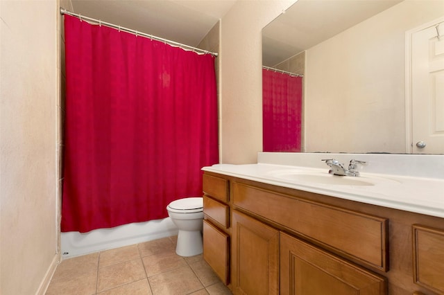 full bathroom with tile patterned flooring, shower / bath combo with shower curtain, vanity, and toilet