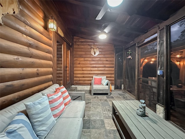 interior space featuring beam ceiling and log walls