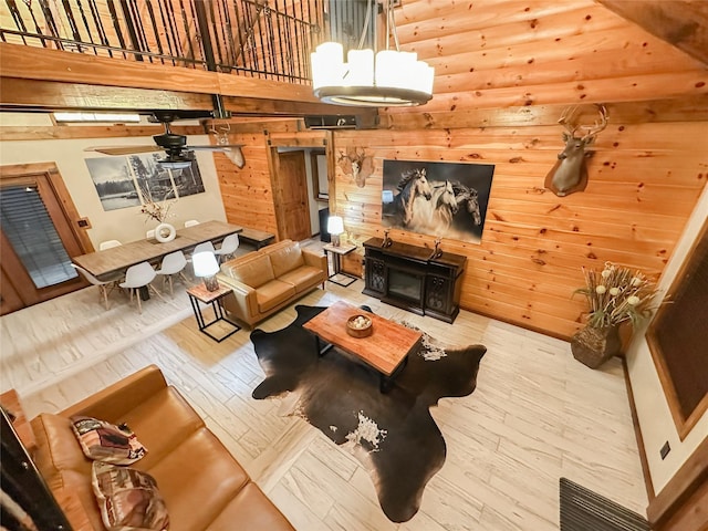 living room featuring wood walls and wood-type flooring