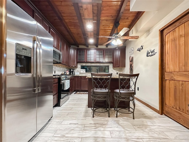 kitchen with ceiling fan, wooden ceiling, stainless steel appliances, tasteful backsplash, and beamed ceiling