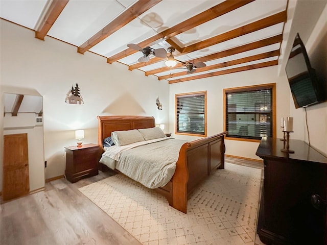 bedroom featuring beam ceiling, light hardwood / wood-style flooring, and ceiling fan