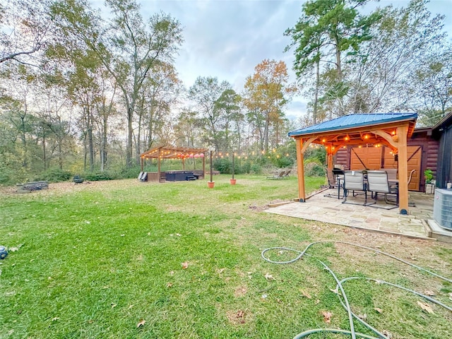 view of yard with a pergola, a patio area, and a gazebo