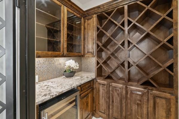 wine area featuring bar area and wine cooler