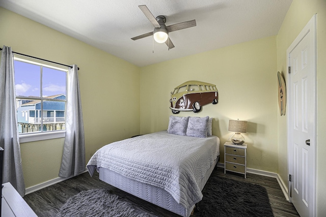 bedroom featuring ceiling fan and dark hardwood / wood-style flooring