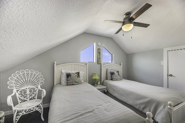 bedroom featuring a textured ceiling, ceiling fan, and lofted ceiling