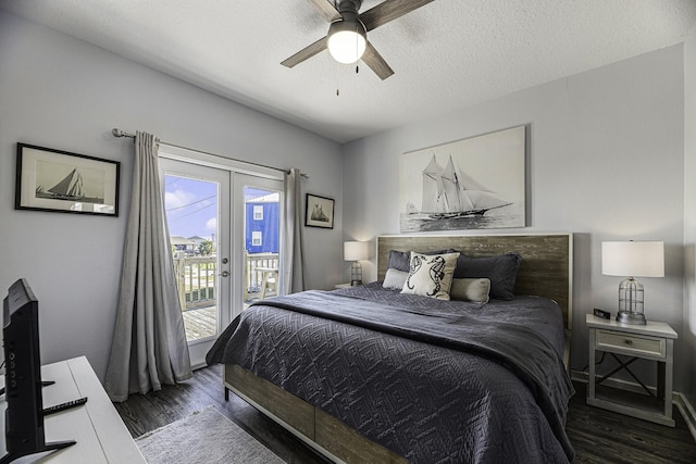 bedroom with access to exterior, ceiling fan, french doors, dark wood-type flooring, and a textured ceiling