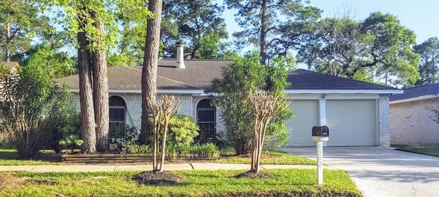 ranch-style house featuring a garage