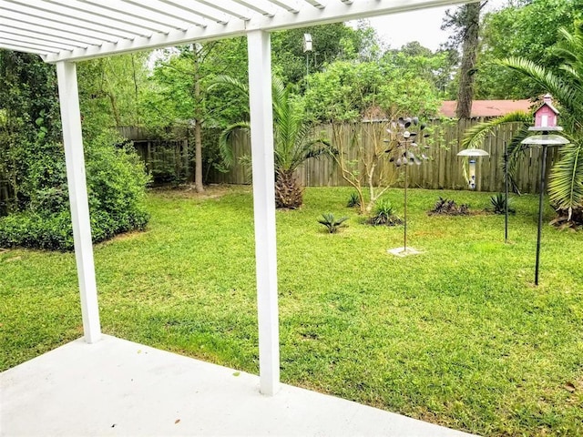 view of yard with a pergola and a patio