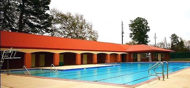 view of swimming pool featuring a patio area