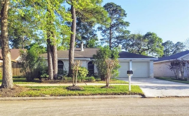 ranch-style home featuring a garage