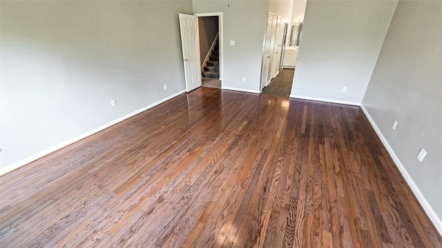 spare room featuring dark hardwood / wood-style flooring