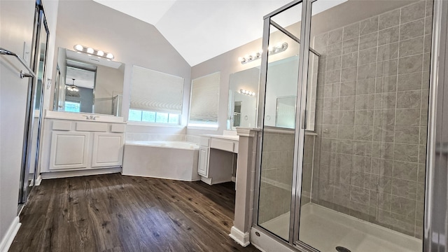 bathroom featuring hardwood / wood-style flooring, vanity, lofted ceiling, and plus walk in shower