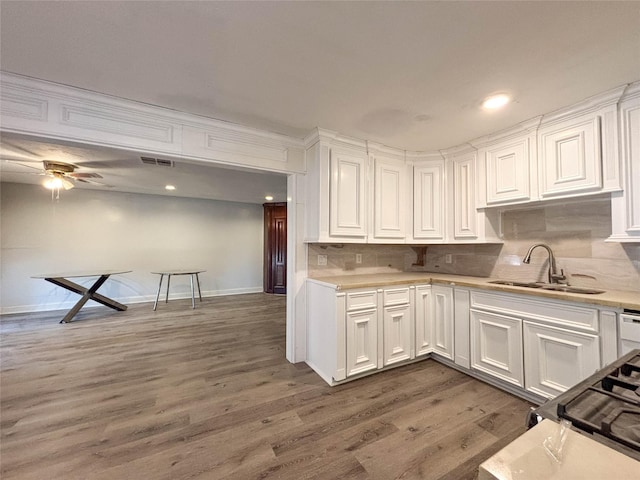 kitchen with dark hardwood / wood-style floors, white cabinetry, ceiling fan, and sink