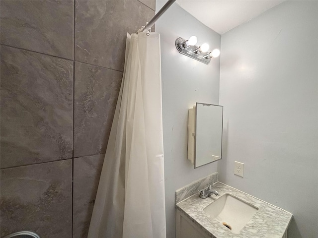 full bathroom with vanity and a shower with shower curtain