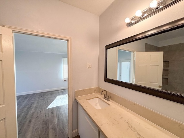 bathroom featuring vanity and wood-type flooring