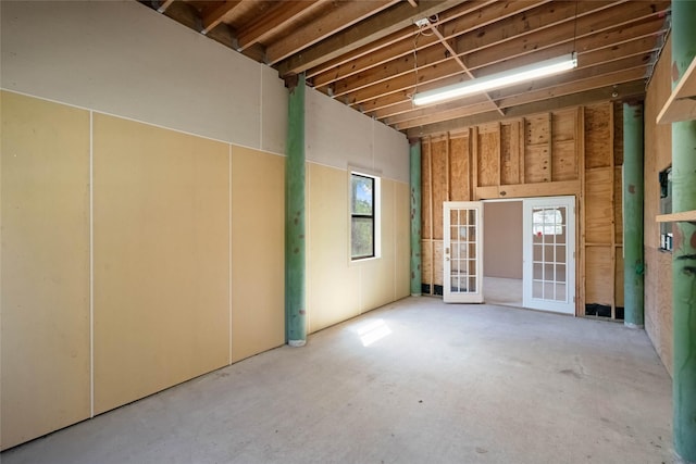 miscellaneous room with a wealth of natural light and concrete floors