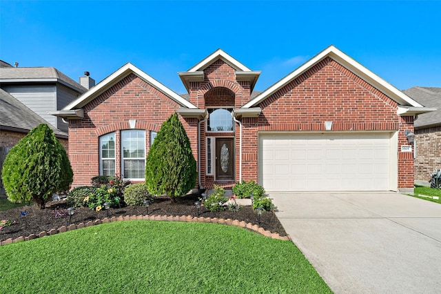 view of front property with a garage and a front yard