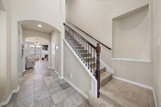 stairway with ceiling fan