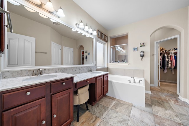 bathroom featuring vanity and plus walk in shower