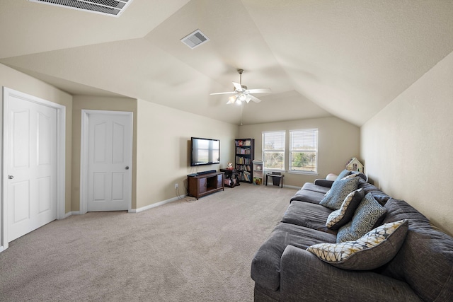 living room with ceiling fan, lofted ceiling, and carpet flooring