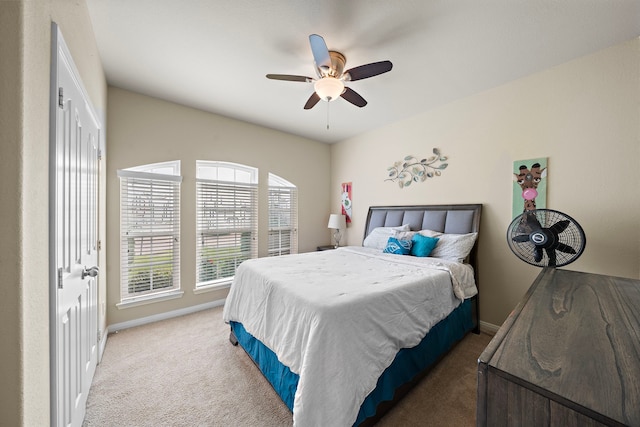 carpeted bedroom featuring ceiling fan