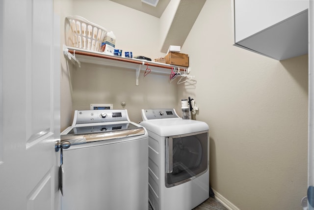 washroom with washer and dryer