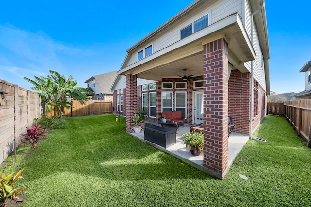 back of house with a patio, a yard, and ceiling fan