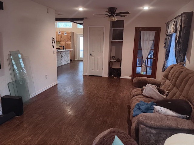 living room featuring ceiling fan and dark hardwood / wood-style flooring