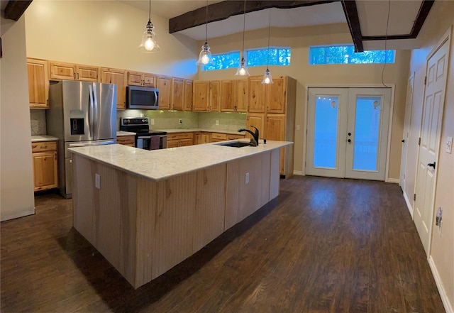 kitchen with pendant lighting, backsplash, a high ceiling, a large island, and stainless steel appliances