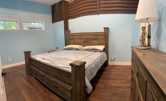 bedroom with dark wood-type flooring