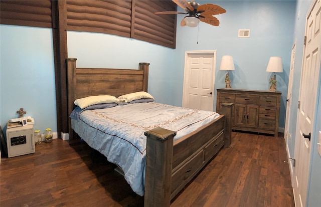 bedroom featuring ceiling fan and dark wood-type flooring