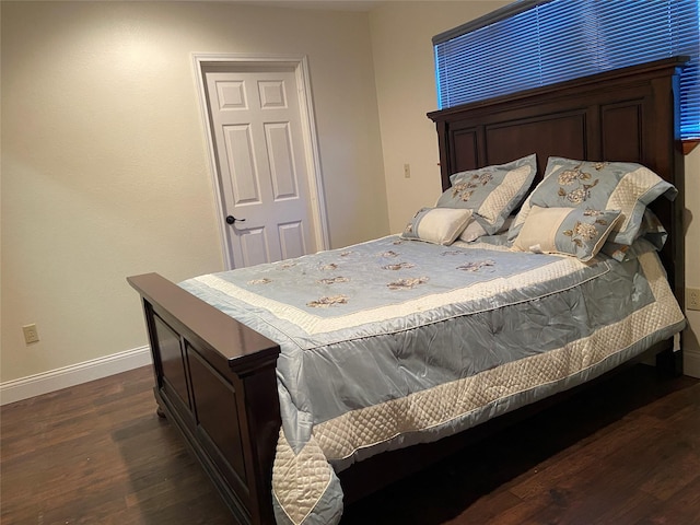 bedroom featuring dark hardwood / wood-style floors