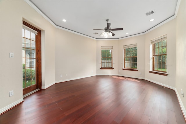 unfurnished room featuring dark hardwood / wood-style flooring, ceiling fan, and ornamental molding