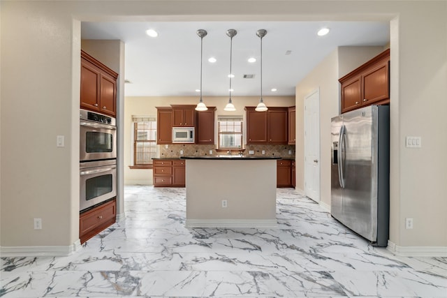 kitchen featuring backsplash, a center island, stainless steel appliances, and decorative light fixtures