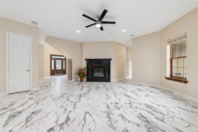 unfurnished living room with ceiling fan