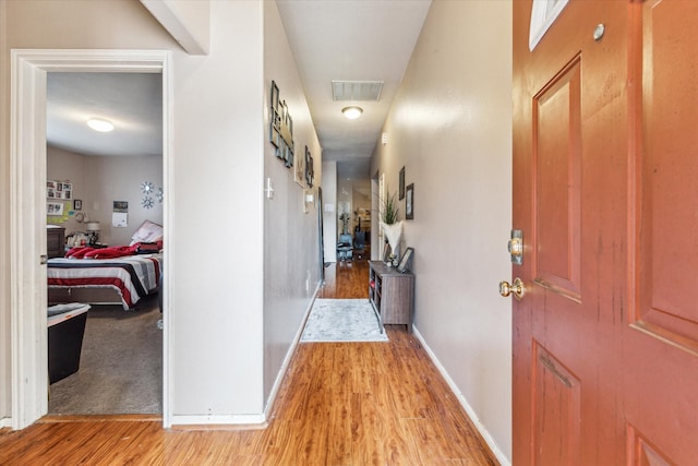 hallway featuring light wood-type flooring