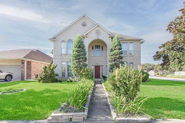 view of front of home featuring a garage and a front yard