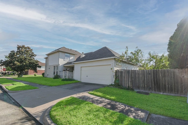 view of front of house featuring a front yard and a garage