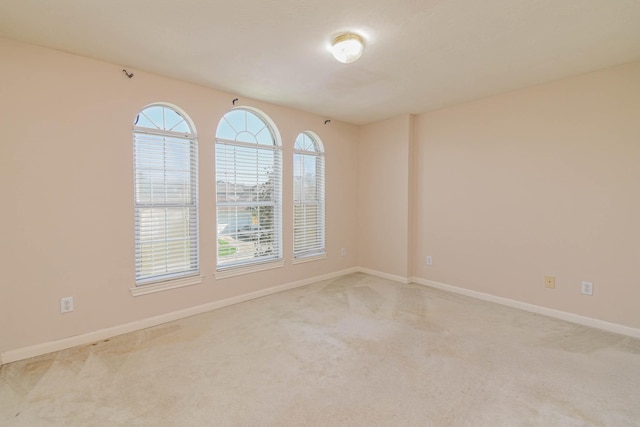 empty room with light colored carpet