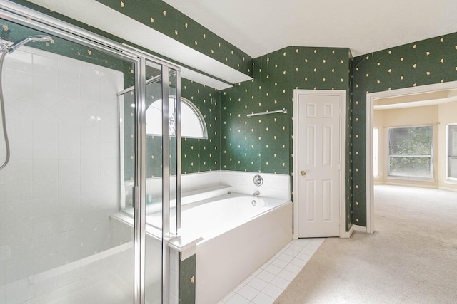 bathroom with tile patterned flooring and independent shower and bath